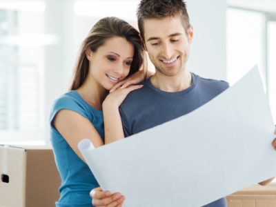 Couple-Looking-At-Plans-From-Remodeling-Contractor
